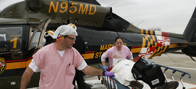 Patient being received from helicopter
