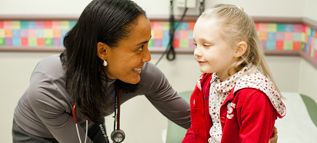 Nurse caring for a little girl