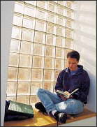 Student studying in front of a window