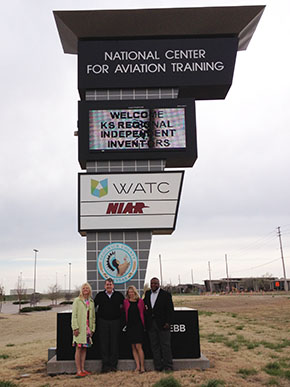 USPTO employees standing in front of sign for National Center for Aviation Training