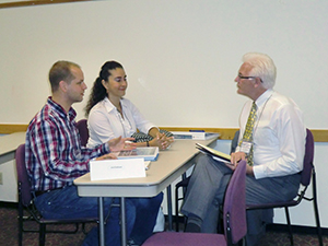 Attendees at the Austin Independent Inventors Conference sit down with an expert during the one-on-ones.